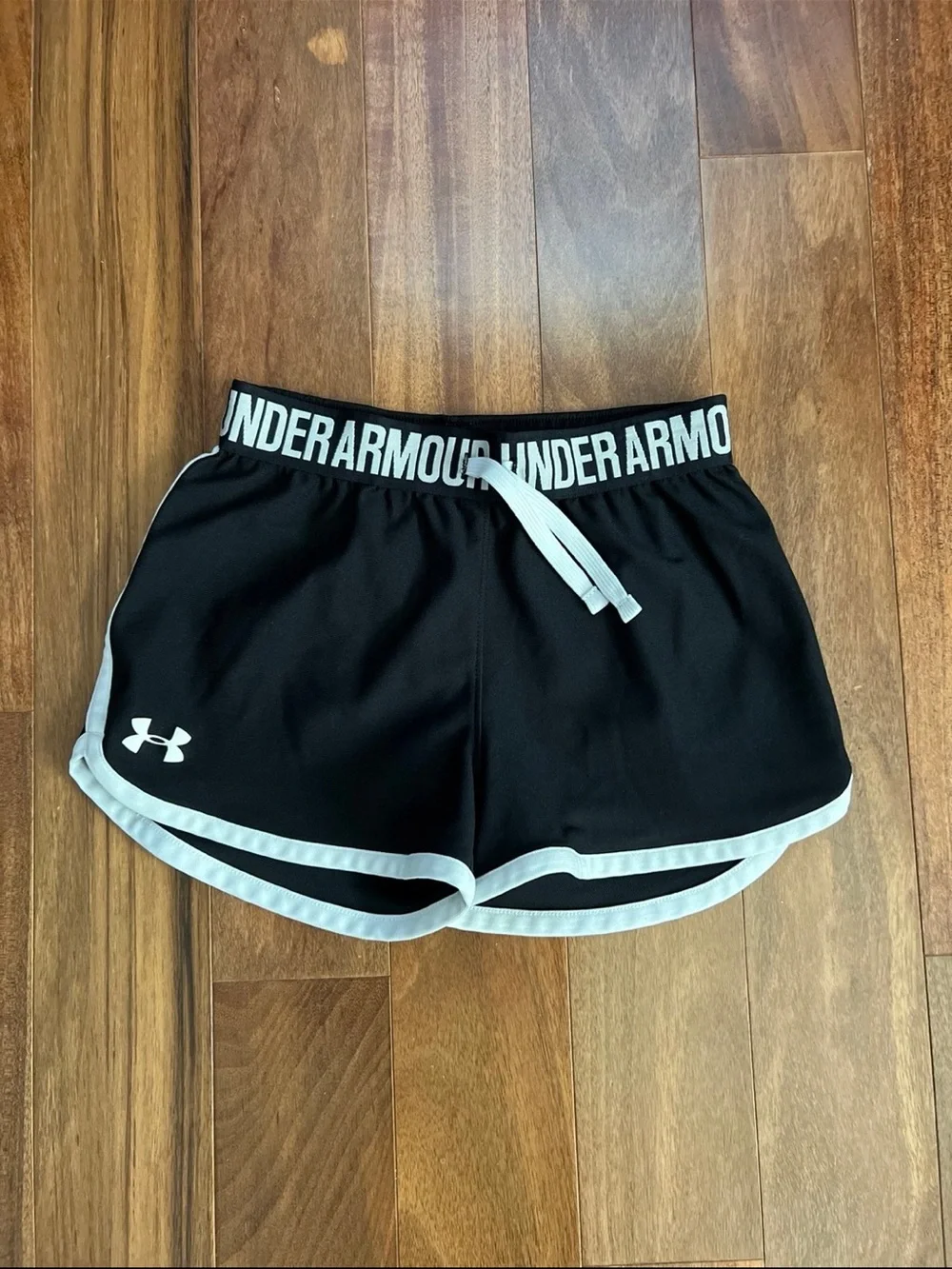 Under Armour Black Athletic Shorts with White Trim and Branded Waistband